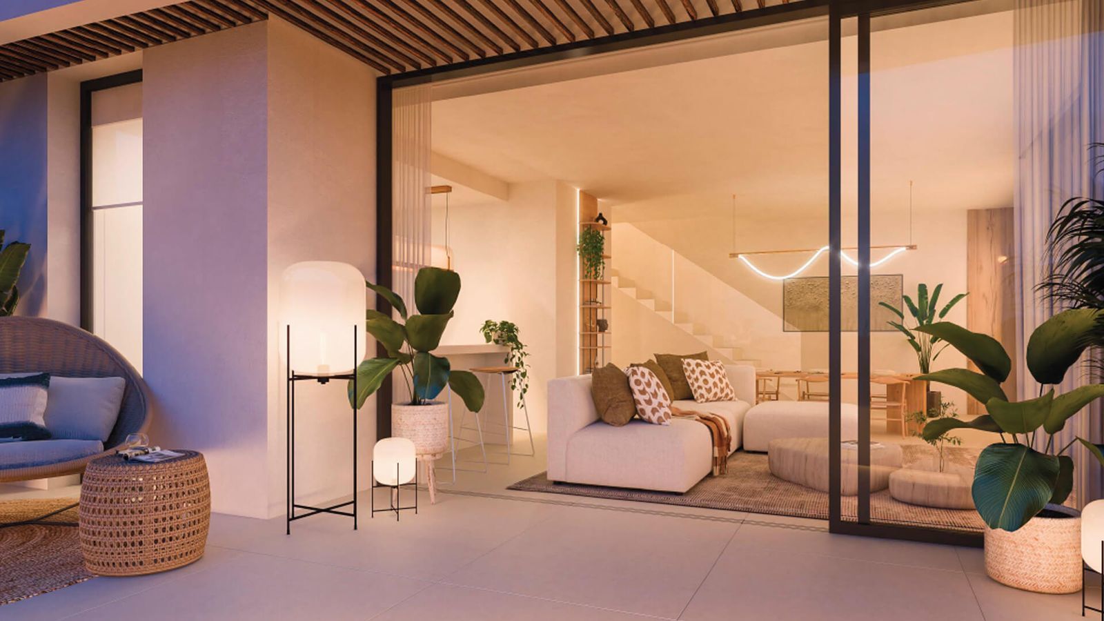 Moderne indoor-outdoor woonkamer met terras en zithoek.